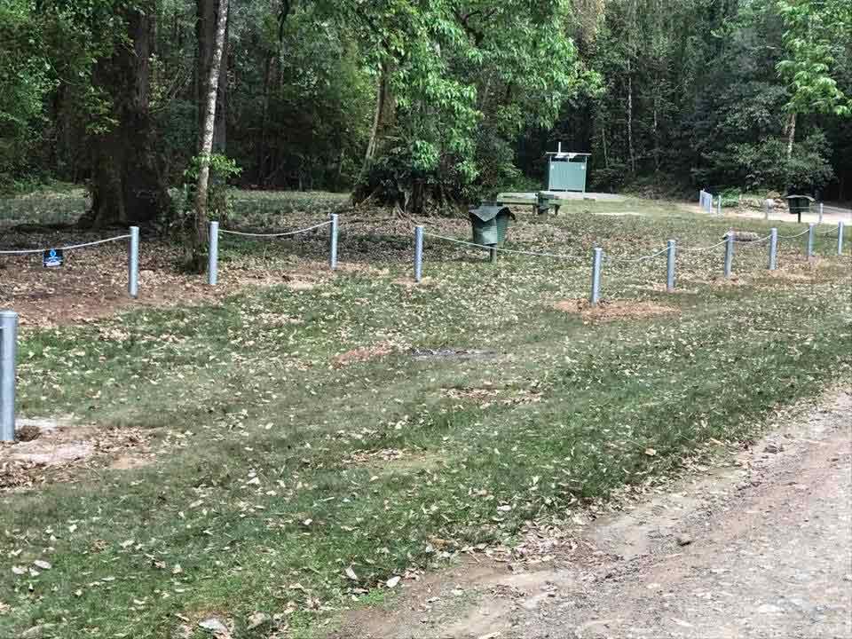 Rural boundary fencing installed along a property driveway